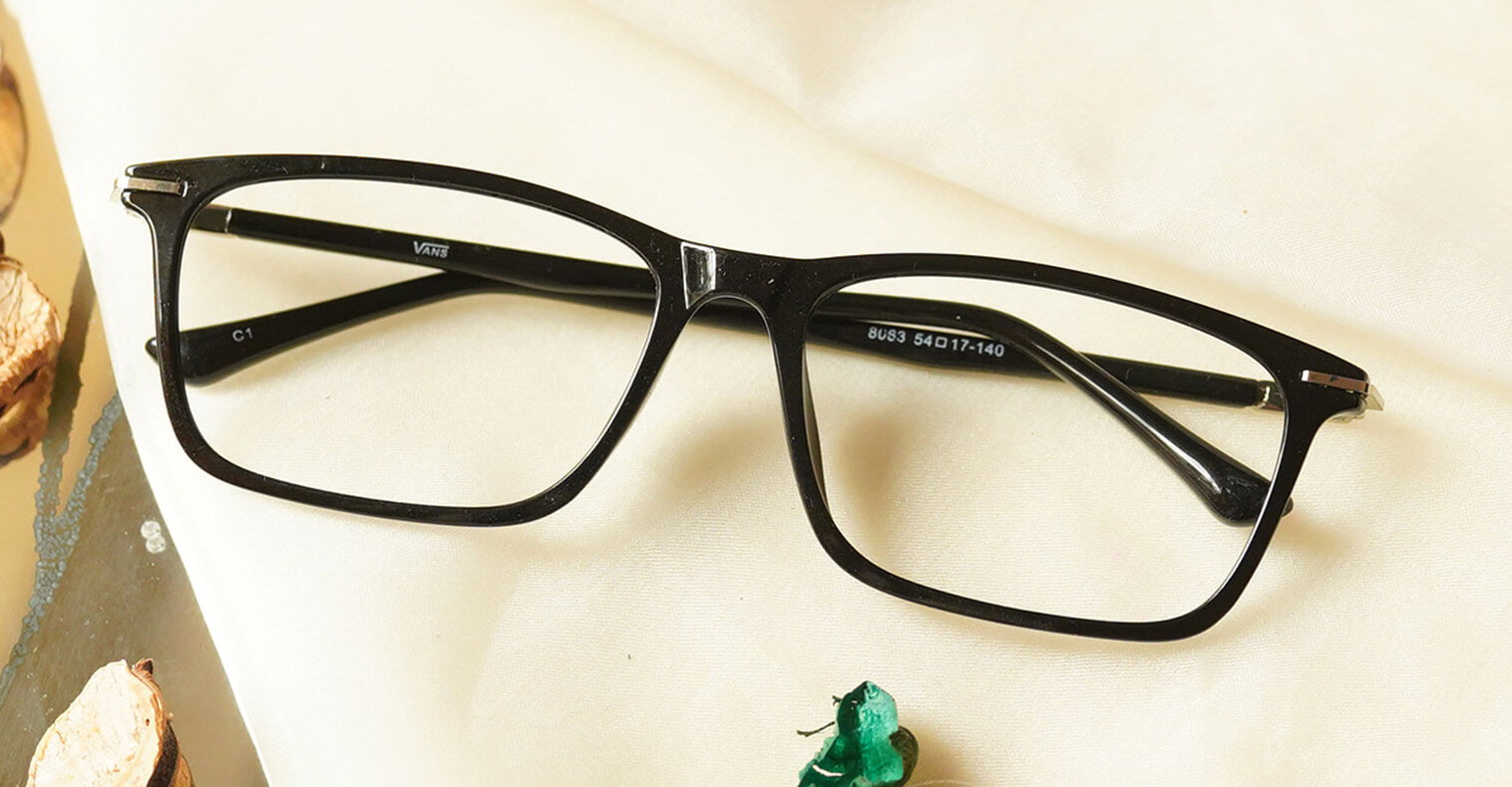 Exquisite Eyeglasses - Black placed on the table