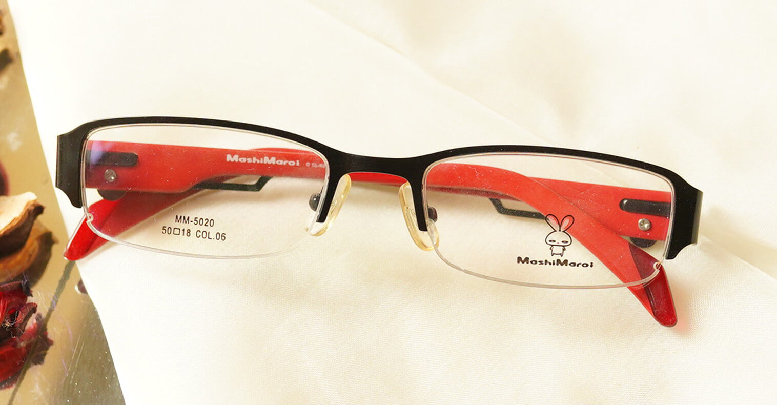 Formidable Eyeglasses - Red placed on the table