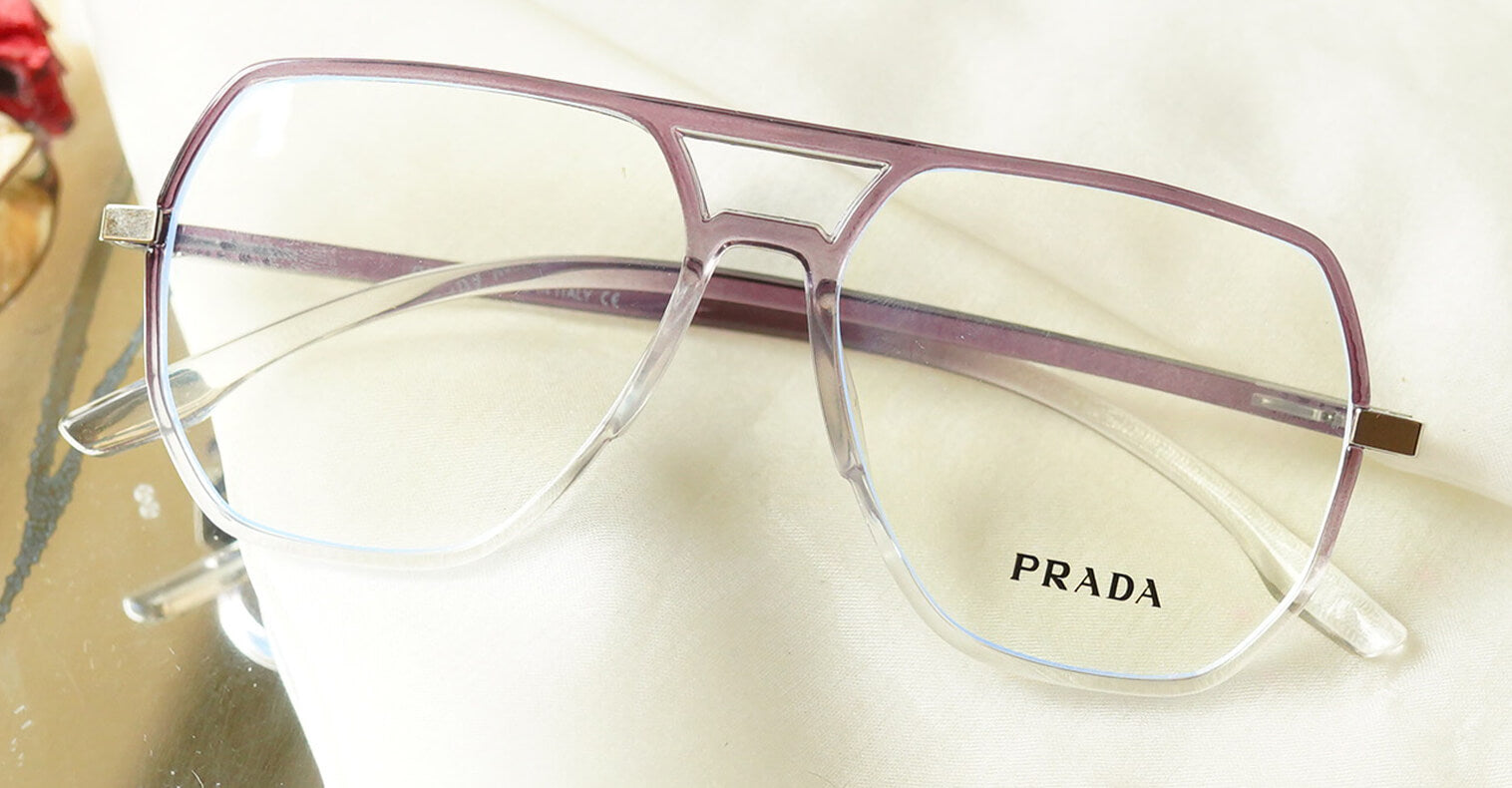 Flowery Eyeglasses - Purple placed on the table