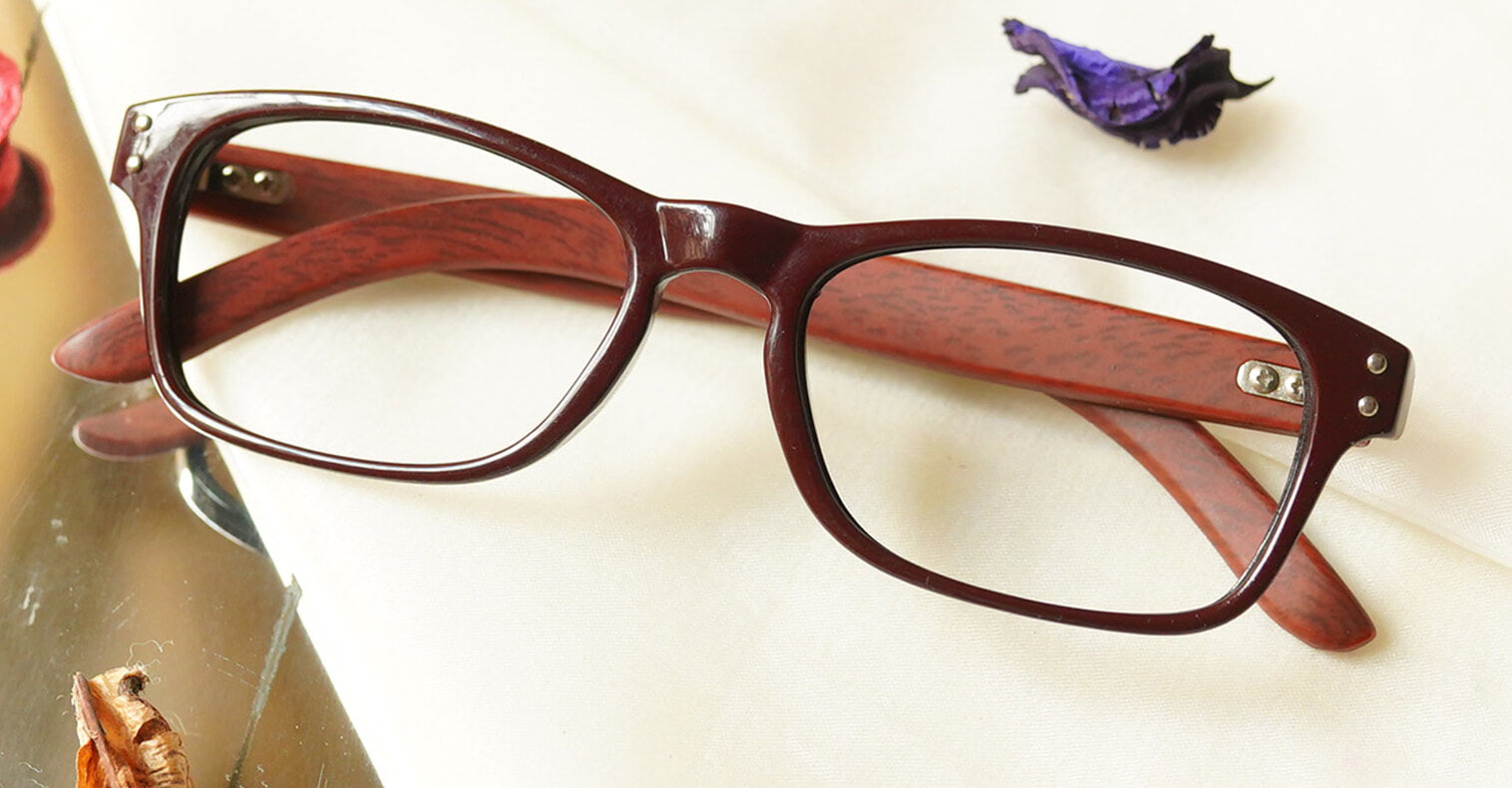 Uniek Eyeglasses - Brown placed on the table