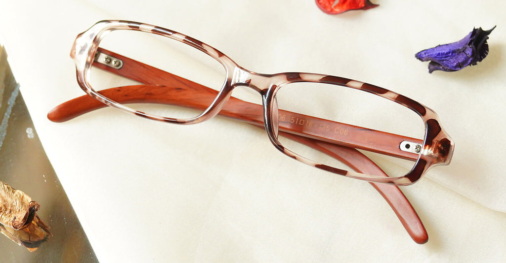 Stilvoll Eyeglasses - Leopard Brown placed on the table