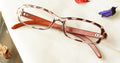 Stilvoll Eyeglasses - Leopard Brown placed on the table