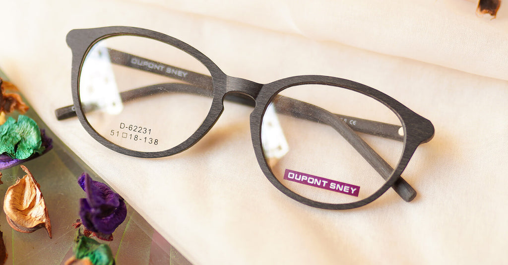 Fervor Eyeglasses - Black placed on the table