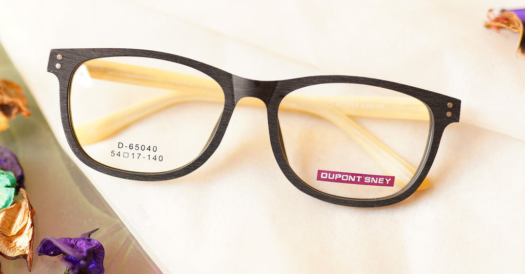 Benevolent Eyeglasses - Black placed on the table