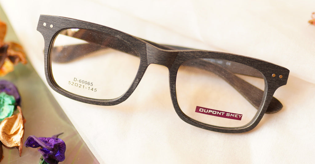 Omnipotent Eyeglasses - Black placed on the table