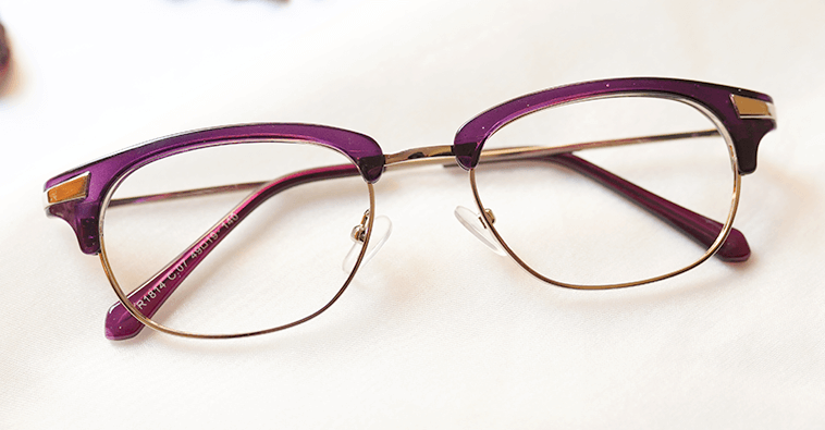 Bonic Eyeglasses - Purple placed on the table