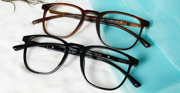 two Exquisite blue cut eyeglasses placed on the table