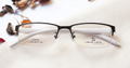 Horizon Eyeglasses - Black placed on the table