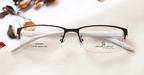 Horizon Eyeglasses - Black placed on the table