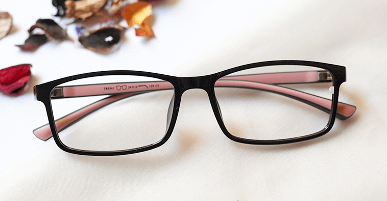 Noteworth Eyeglasses - Black placed on the table
