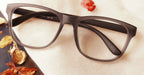 Nzuri gray colour eyeglasses placed on the table