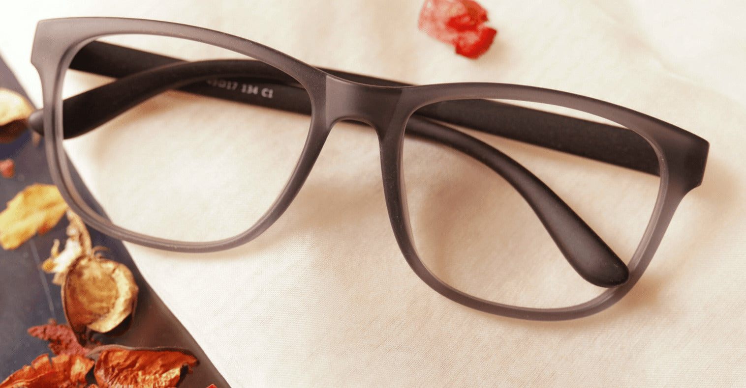Nzuri gray colour eyeglasses placed on the table