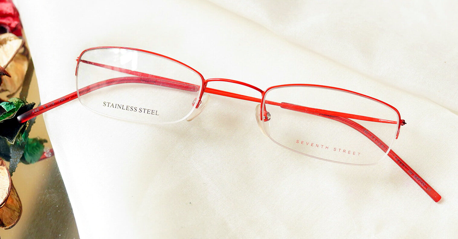 Rectangle Eyeglasses - Red placed on the table