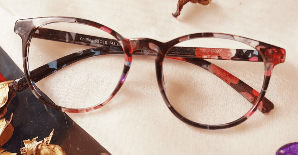 Swah eyeglasses - multi flower design placed on the table
