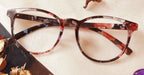 Swah eyeglasses - multi flower design placed on the table