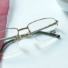 Wunderbar rimless eyeglasses placed on the white table