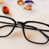 front side of Optimal blue cut square shape shine black colored glasses frame
