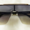 Amazeball Sunglasses - Black Golden placed on the table
