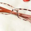 Stilvoll Eyeglasses - Leopard Brown placed on the table