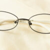 Grandioso Eyeglasses - Black and White placed on the table