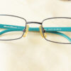Superioran Eyeglasses - Blue placed on the table